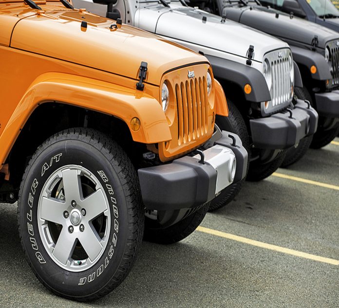 Row of Jeep Wranglers at a Car Dealership